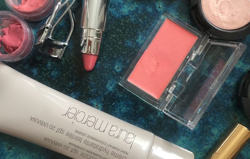 Products for a makeup optimized for a computer screen: Laura Mercier Tinted Moisturiser, YSL Touche Eclat, MAC Cream Color Base, peachy blush.